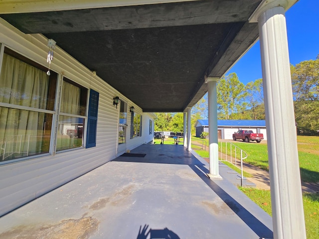 view of patio featuring a porch