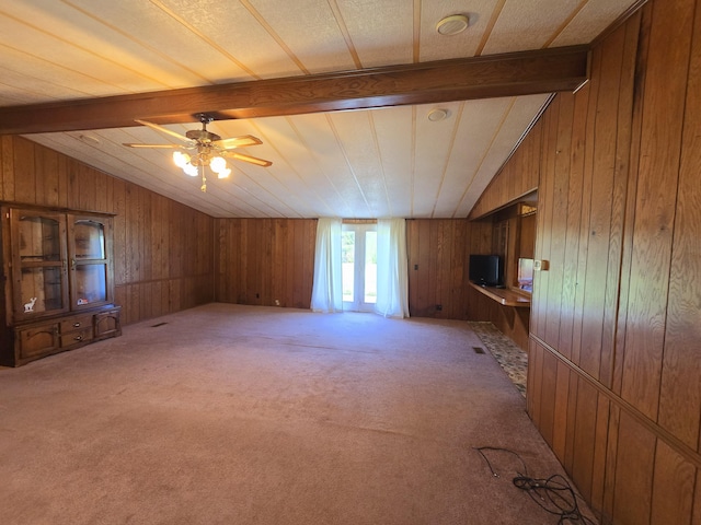 163 Eulett Ln, Vanceburg, KY 41179 - unfurnished living room with light carpet, wood walls, and a ceiling fan