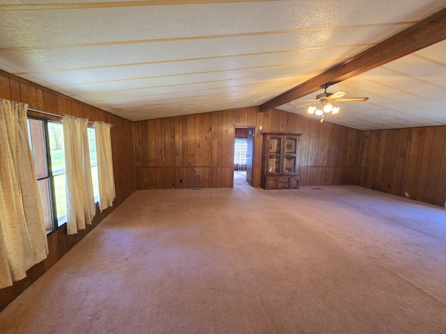 163 Eulett Ln, Vanceburg, KY 41179 - unfurnished living room featuring carpet flooring, wood walls, a ceiling fan, and a textured ceiling