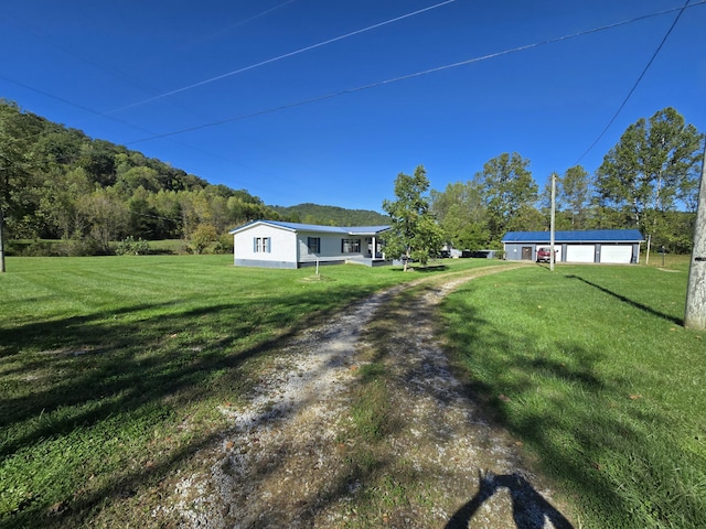 163 Eulett Ln, Vanceburg, KY 41179 - view of grassy yard with a garage and driveway