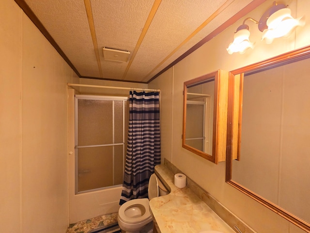 full bathroom with vanity, shower / tub combo, toilet, and a textured ceiling