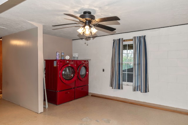 laundry area with ceiling fan, washer and dryer, and a textured ceiling