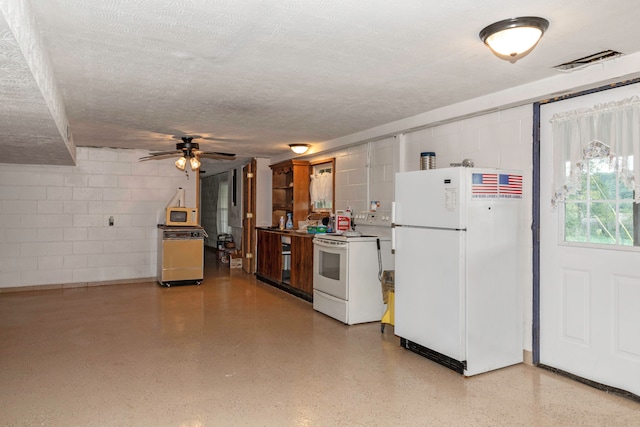 kitchen with ceiling fan, a textured ceiling, and white appliances