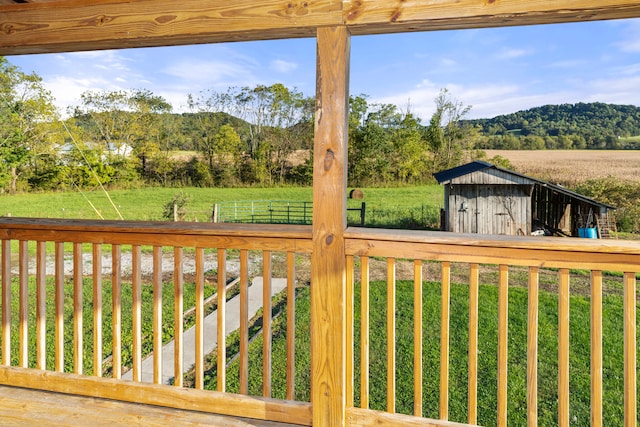 exterior space featuring a rural view and a storage shed