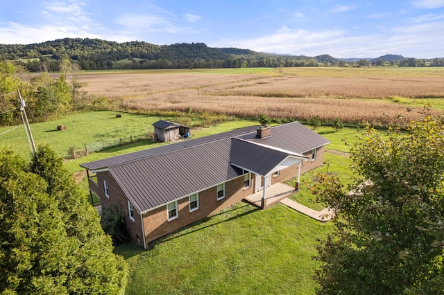 bird's eye view with a mountain view and a rural view