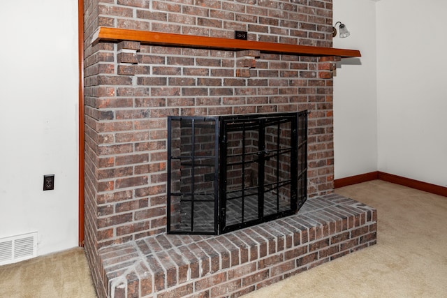 room details with a brick fireplace and carpet flooring