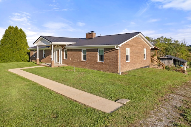 view of side of home featuring a lawn