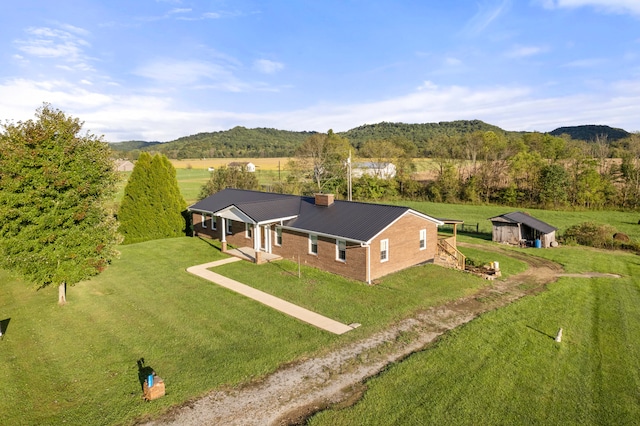 drone / aerial view featuring a mountain view