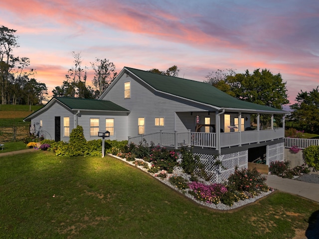 view of front of property with a yard and a porch