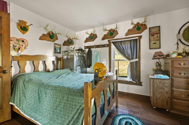 bedroom featuring dark wood-type flooring