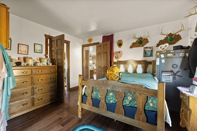 bedroom with dark hardwood / wood-style flooring