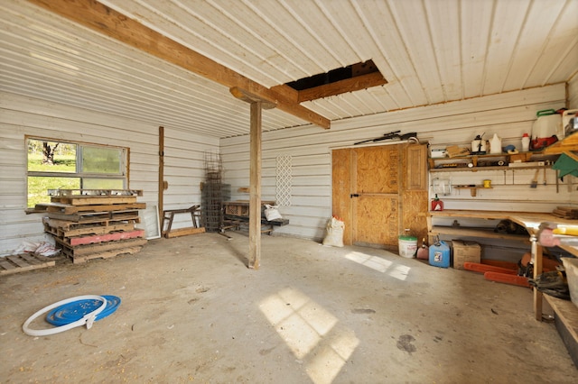 interior space with a workshop area and concrete flooring