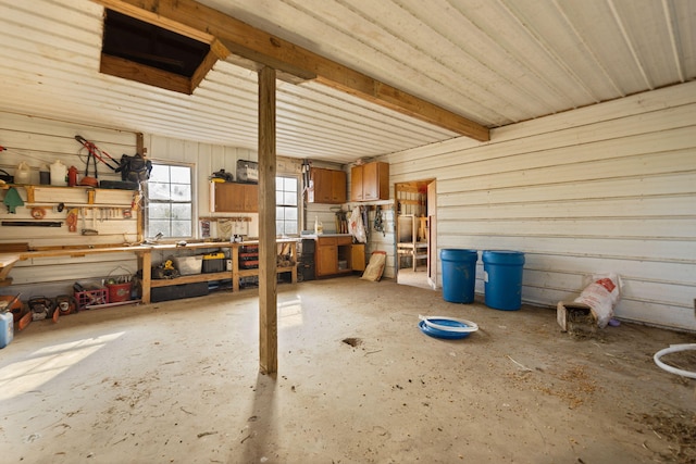 interior space featuring a workshop area and concrete floors