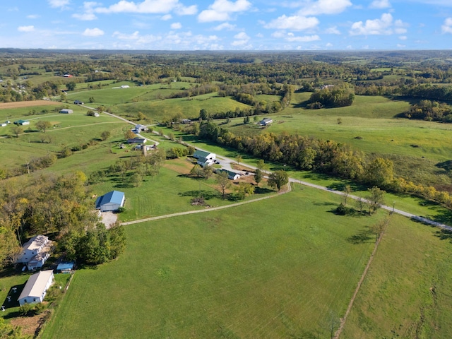 birds eye view of property with a rural view