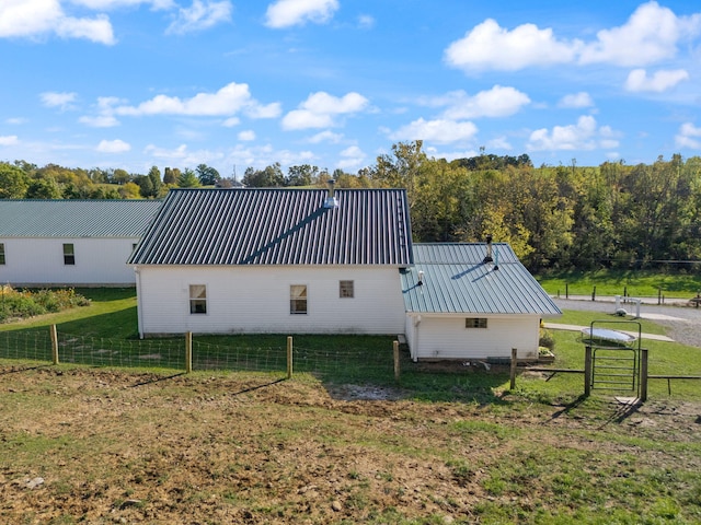 view of side of home featuring a lawn