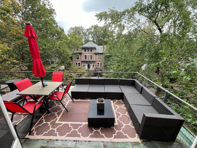 view of patio with a balcony and an outdoor hangout area