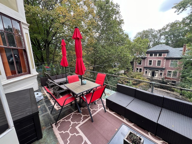 view of patio with a balcony and an outdoor living space