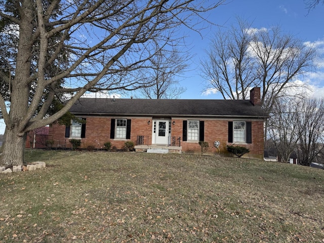 ranch-style home with a front lawn