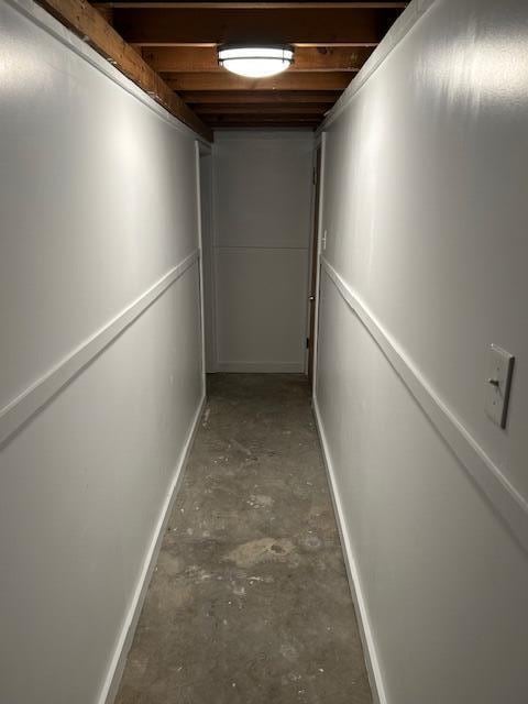 hall with concrete flooring