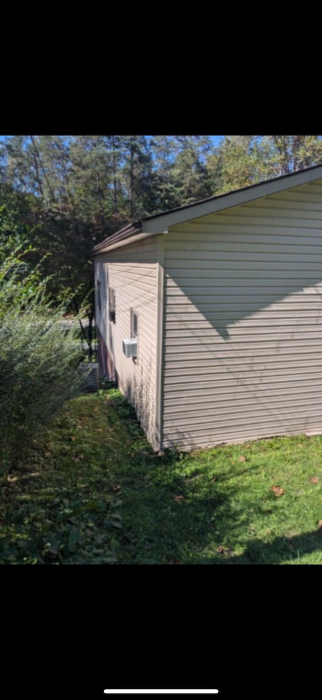 view of home's exterior with cooling unit