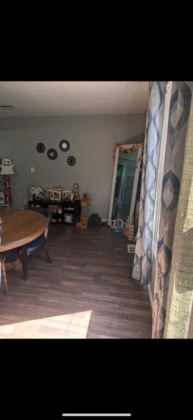 dining room with hardwood / wood-style flooring