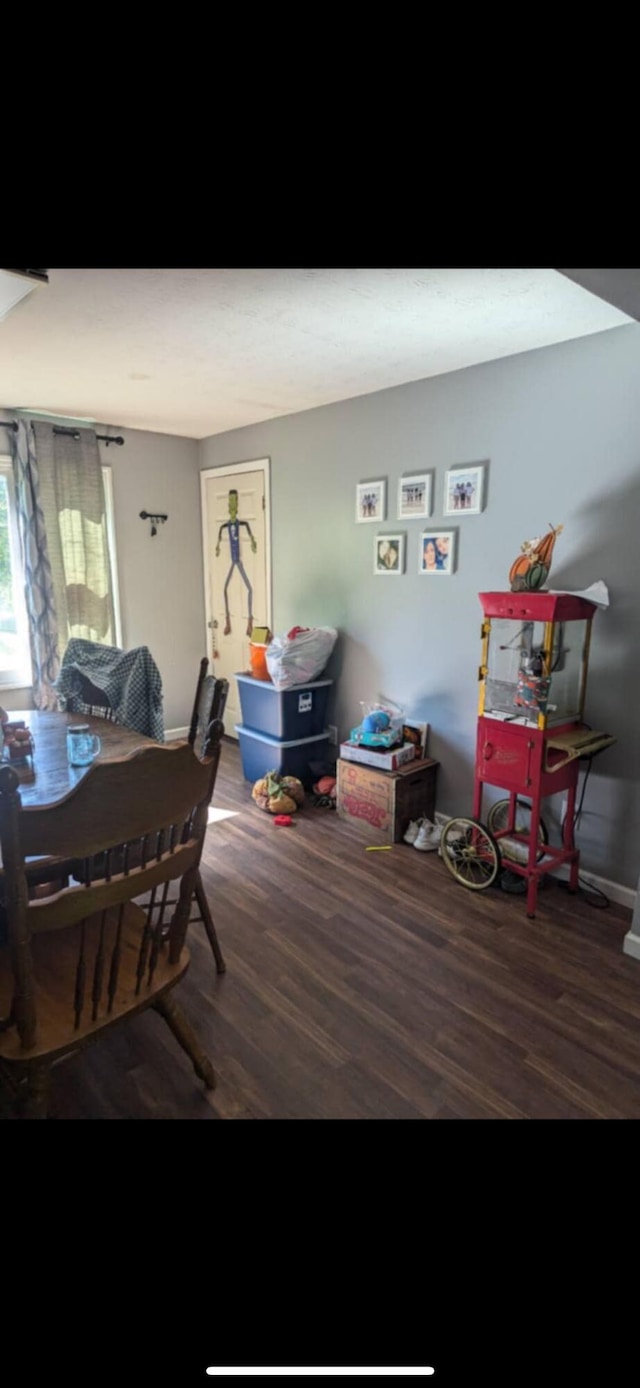 dining room with dark hardwood / wood-style flooring