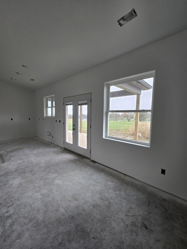 unfurnished room with french doors