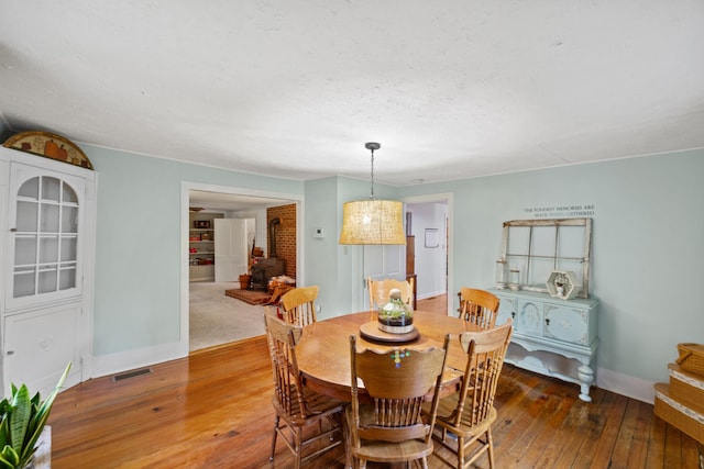 dining space with dark wood-type flooring