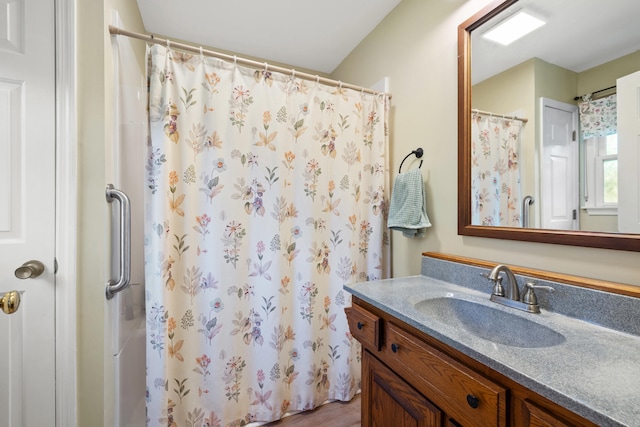 bathroom with vanity, hardwood / wood-style floors, and a shower with shower curtain