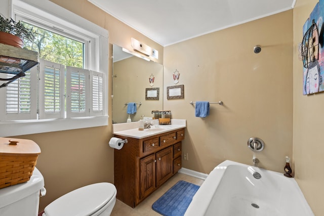 bathroom featuring toilet, vanity, and a bathtub