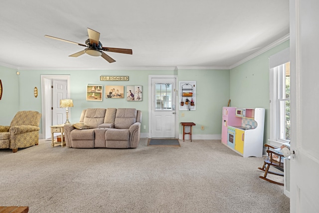 carpeted living room featuring crown molding and ceiling fan