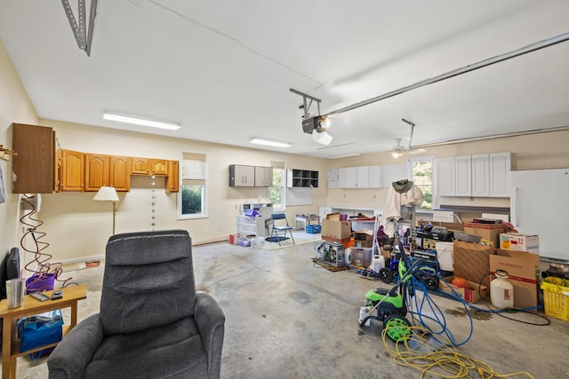 garage featuring a garage door opener and ceiling fan