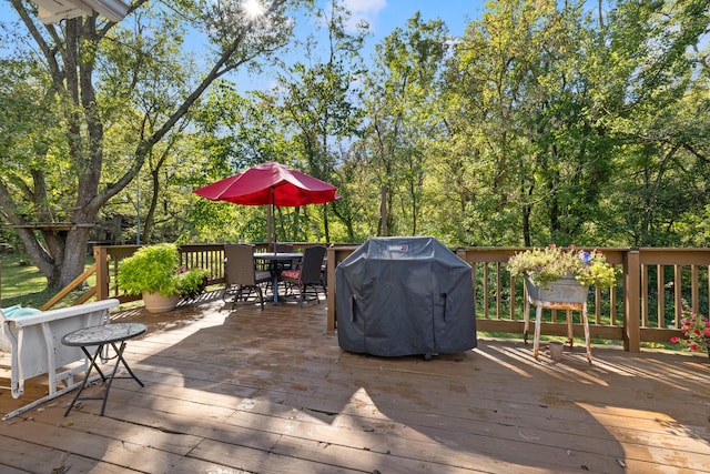 wooden terrace featuring grilling area