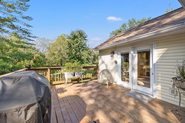 wooden terrace featuring grilling area