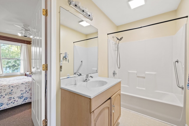 bathroom with vanity, shower / bathing tub combination, and ceiling fan