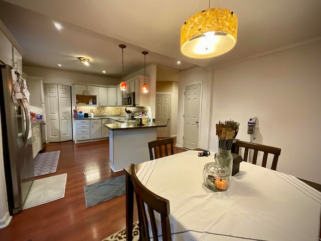 dining room featuring dark hardwood / wood-style flooring