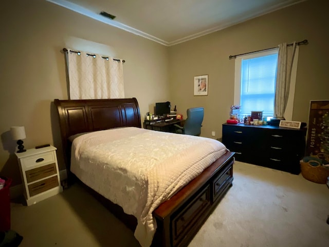 carpeted bedroom with ornamental molding