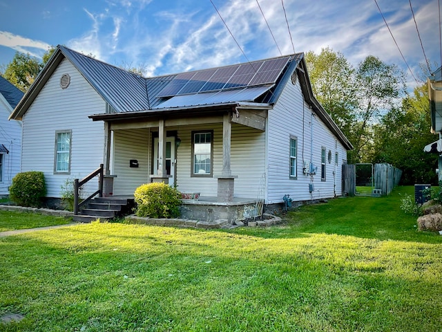 bungalow with a front lawn and a porch