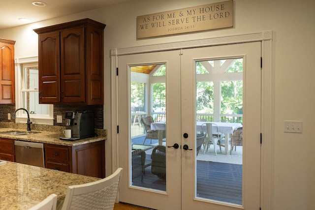 entryway featuring french doors and sink