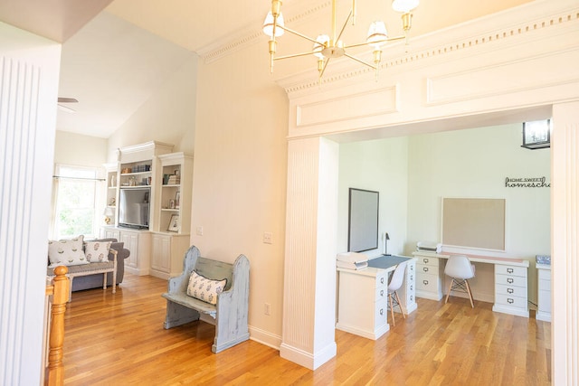 living area with light hardwood / wood-style flooring and high vaulted ceiling