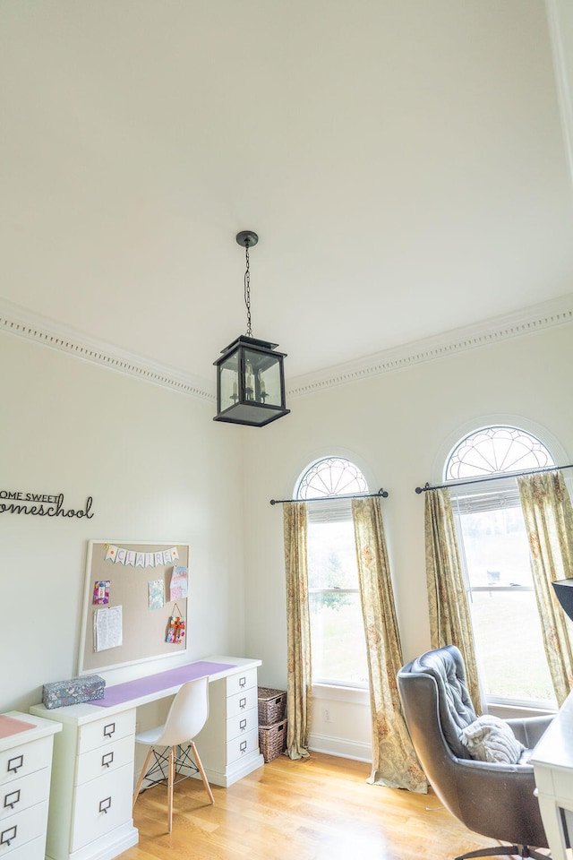 home office with light wood-type flooring and a chandelier