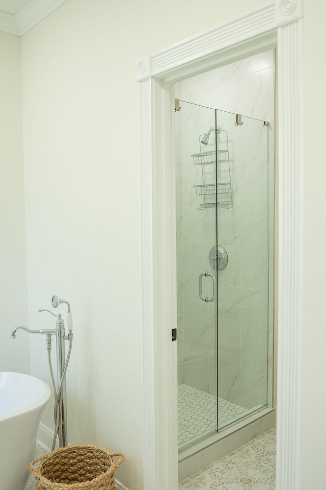 bathroom with independent shower and bath and ornamental molding