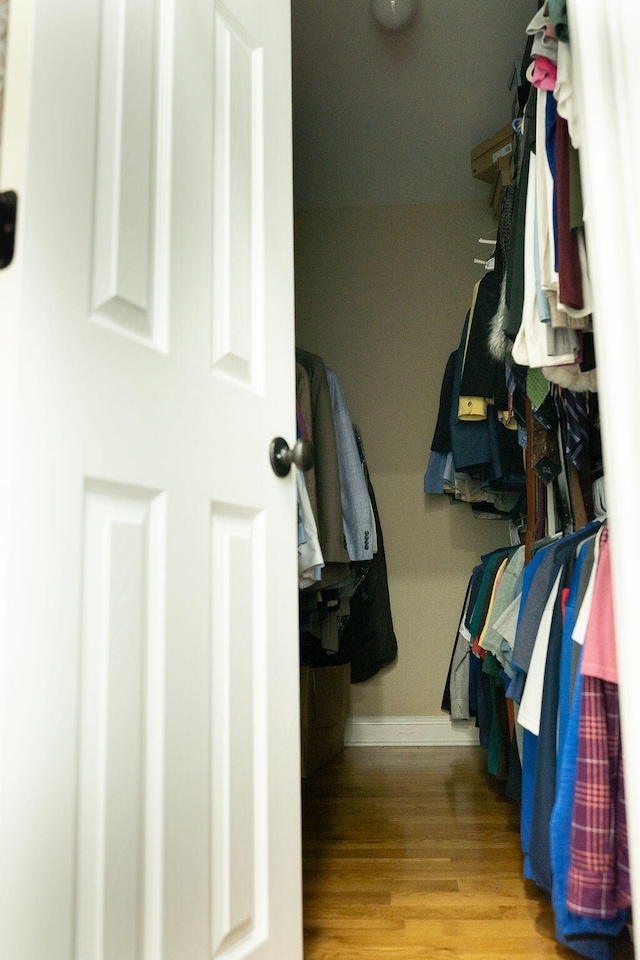 spacious closet featuring light hardwood / wood-style floors