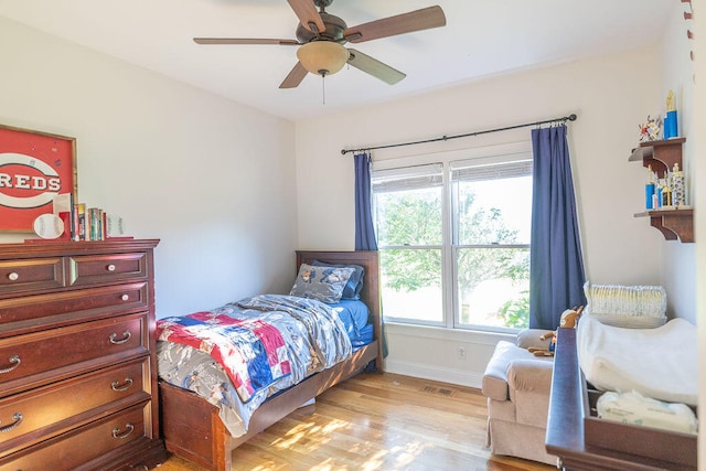 bedroom with ceiling fan and light hardwood / wood-style flooring