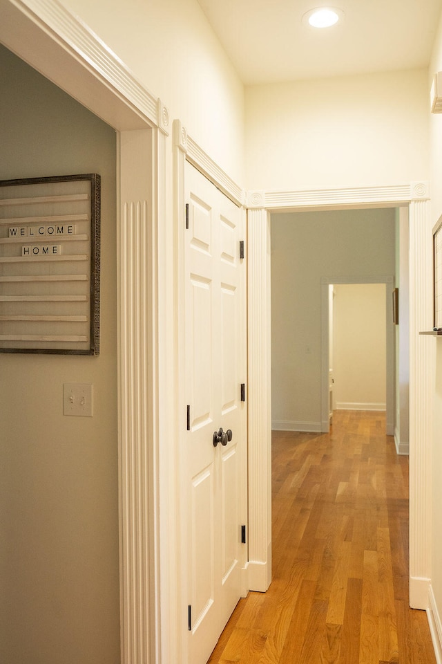 corridor with light wood-type flooring