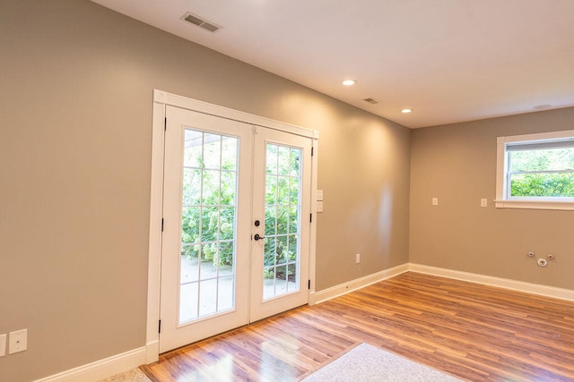 entryway with french doors and hardwood / wood-style floors