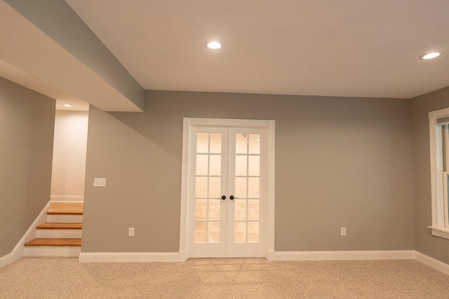 unfurnished room with carpet floors and french doors