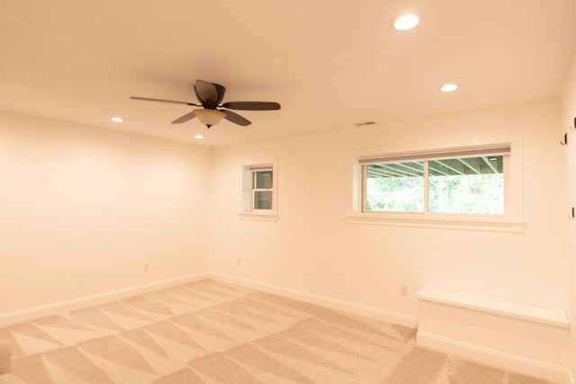 empty room featuring ceiling fan and carpet flooring