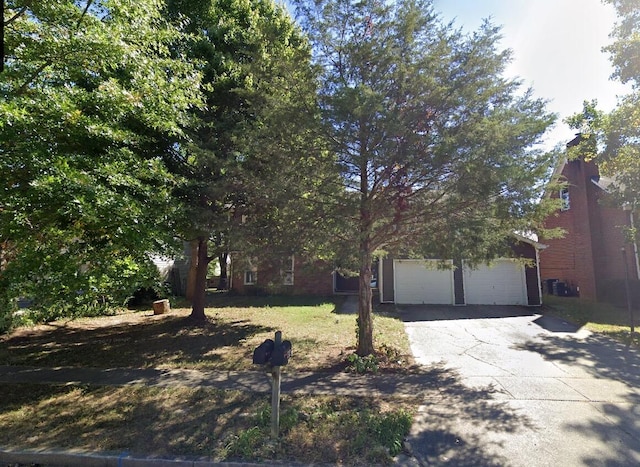 obstructed view of property featuring a garage