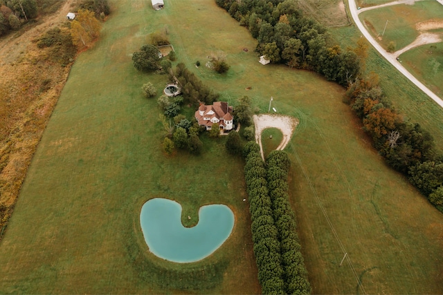 birds eye view of property with a rural view